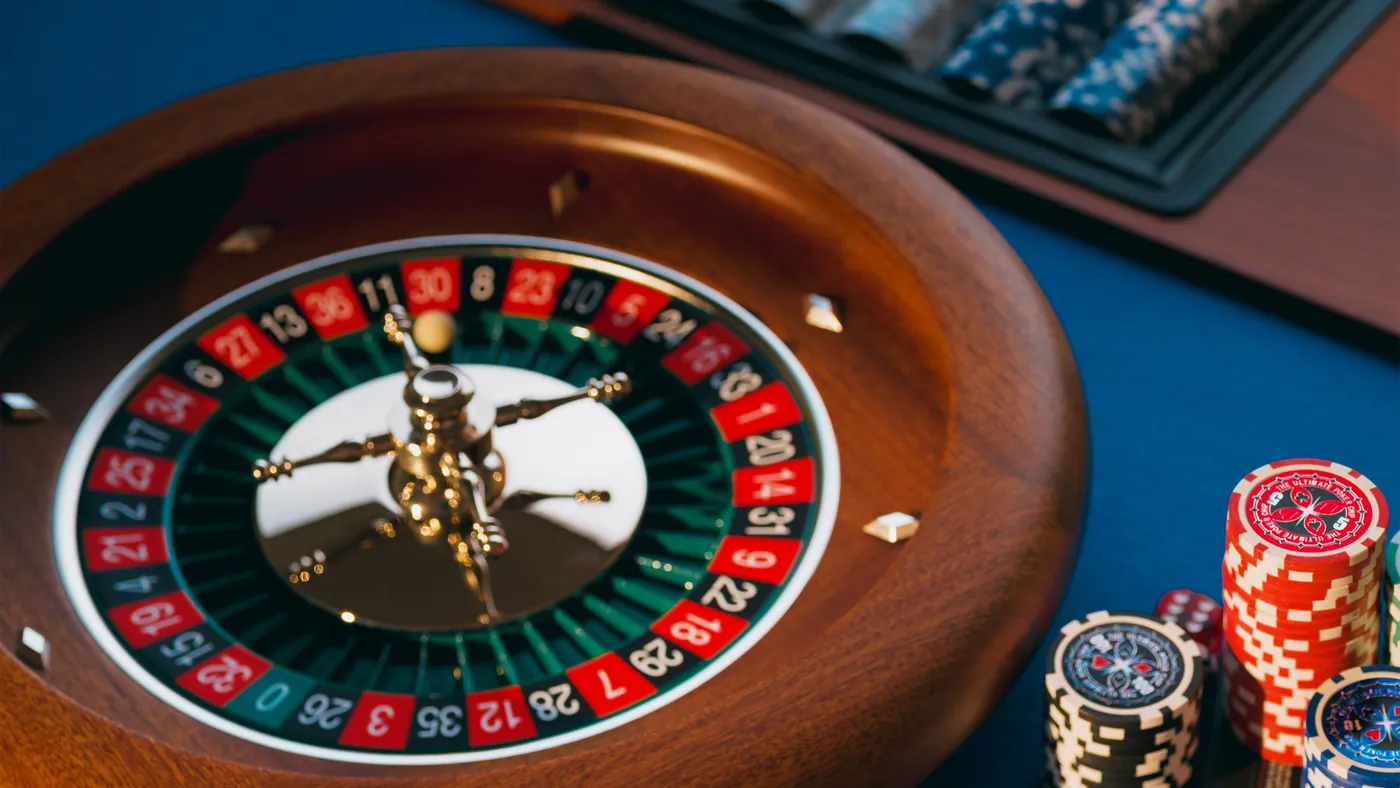 Roulette wheel and chips on a casino table